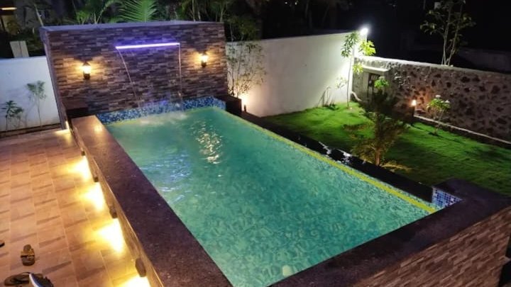 Aerial view of the pool and garden at night